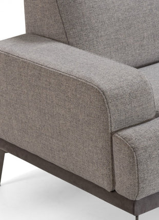 One sofa – detail view of armrest and leg