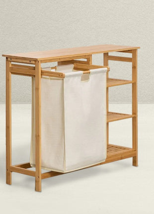 Bamboo laundry hamper with a beige bag on a light background