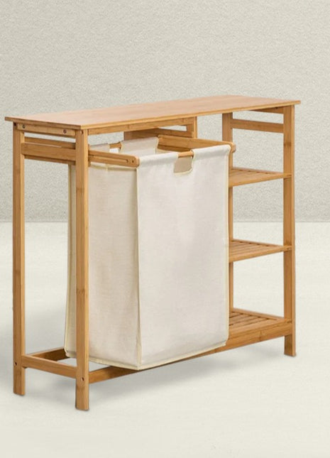 Bamboo laundry hamper with a beige bag on a light background