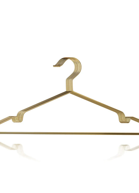 Gold metal hanger on a white background