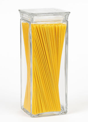 Clear acrylic jar filled with yellow spaghetti on a white background