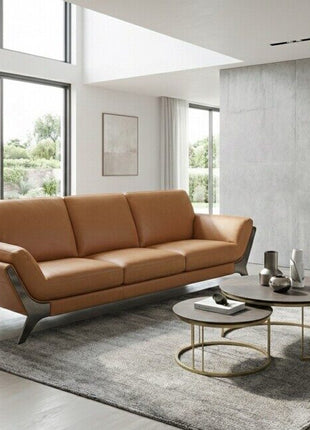 Ostro sofa in dark leather in a luxury living room with dramatic backlit circular wall panel