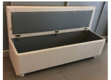 Upholstered storage bench open showing interior