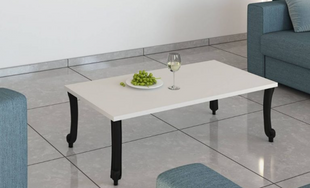 Haven Oak rectangular coffee table with warm natural wood finish and black sculptural legs