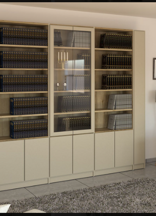 Cream wall bookcase with glass display cabinet and open shelving in a living room setting
